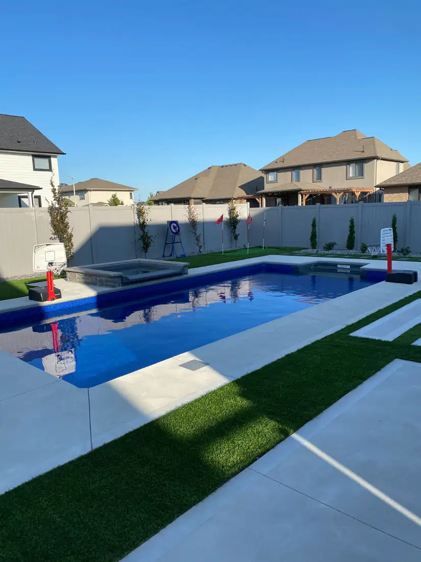 Pool deck: concrete with artificial turf strips