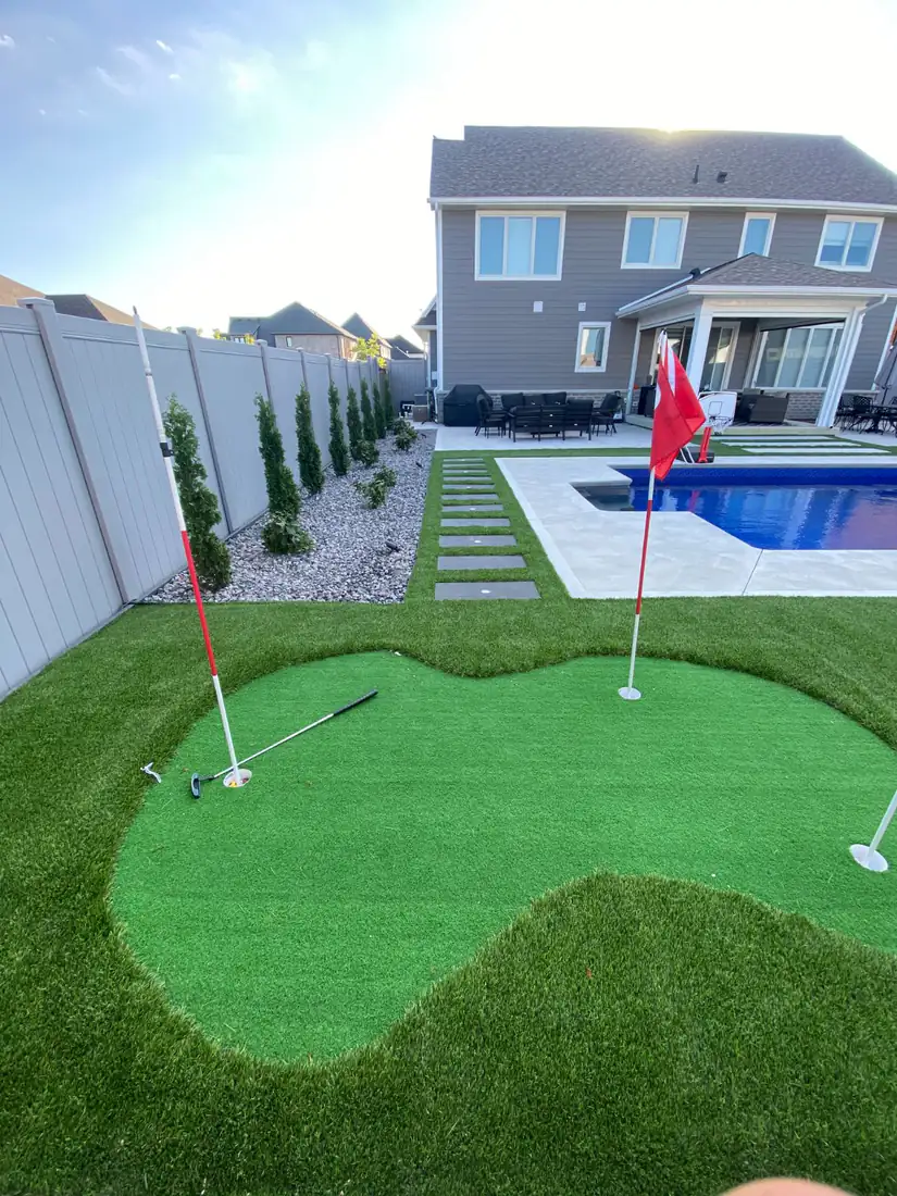 Putting green, with the pool and house behind